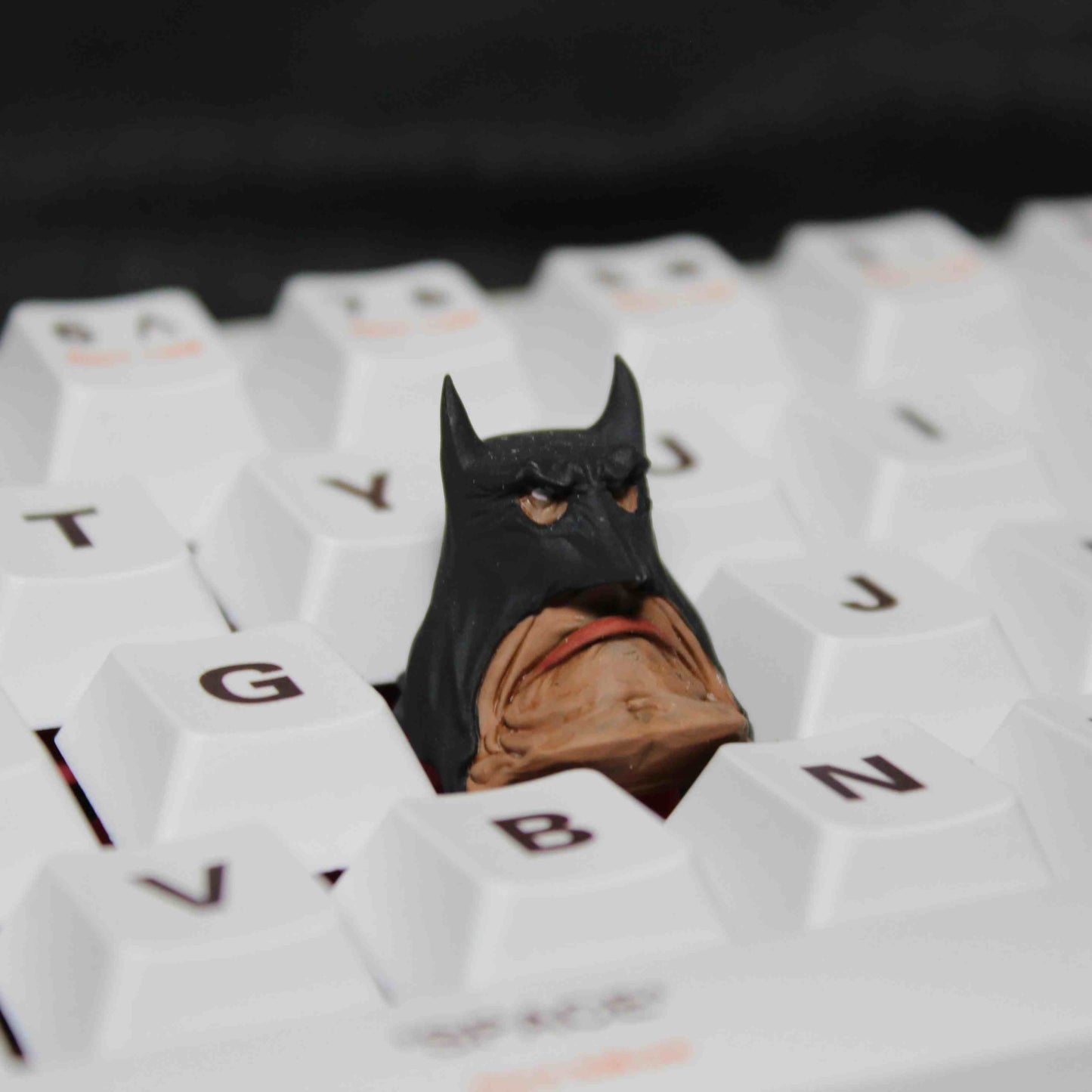 3D-printed Esc Keycap inspired by Batman, designed with precision to enhance the aesthetic of any mechanical keyboard.