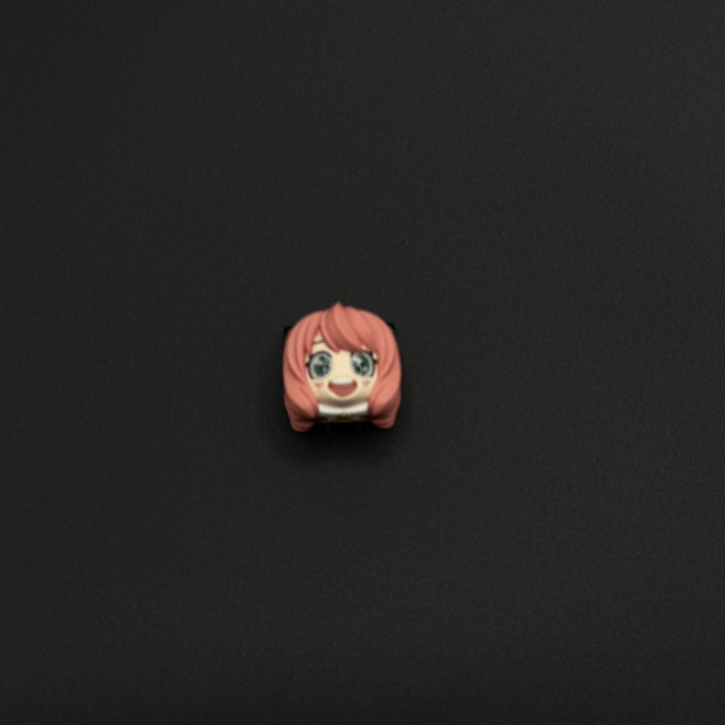 3D Anya Forger keycap in pink, a cute and unique artisan design from SPY x FAMILY to brighten up your mechanical keyboard