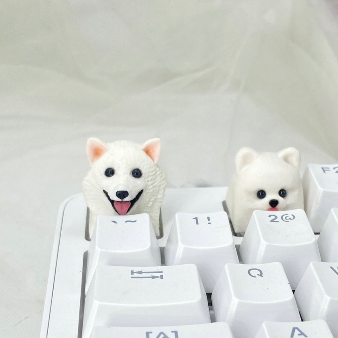Handmade pet keycaps by AiheyStudio for mechanical keyboards. Bring a touch of your pet’s charm to your setup with custom artisan keycaps.
