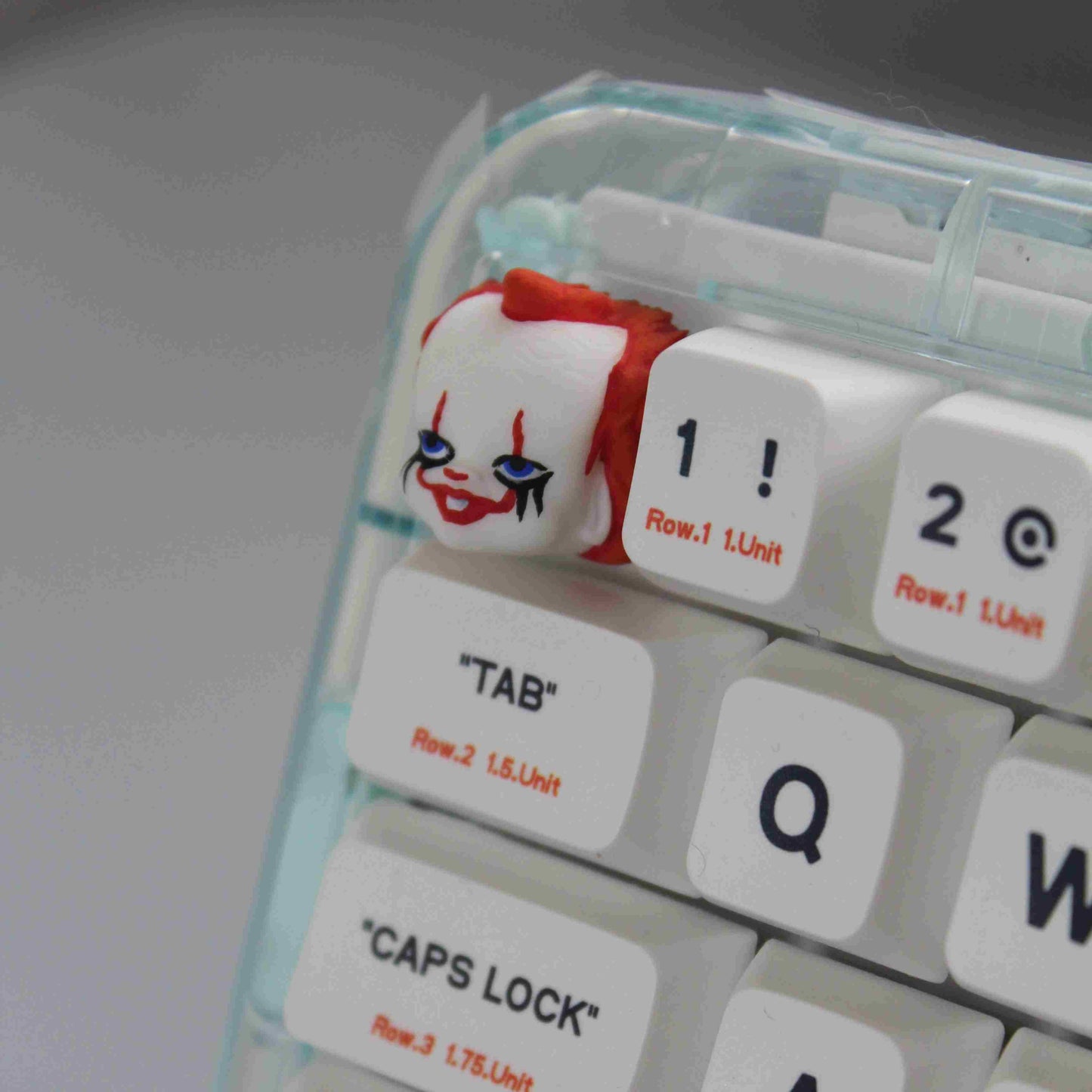 Pennywise Keycap "It" Joker Mask design, a unique artisan keycap for mechanical keyboards, capturing the essence of the iconic horror character.