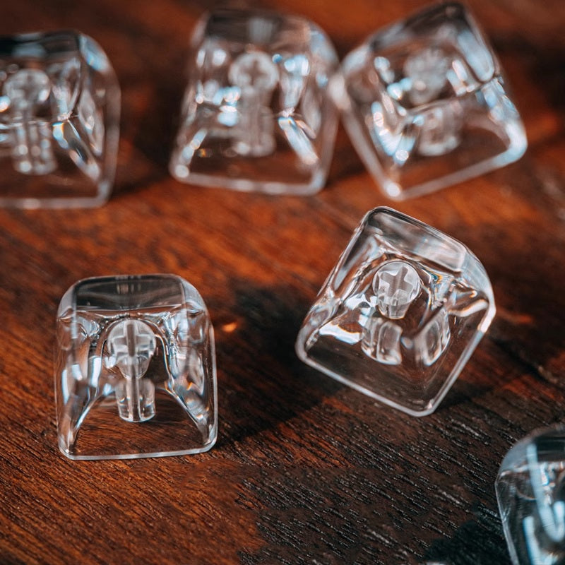 "Dive into a realm of sophistication with our Transparent Keycaps – uniquely crafted with the texture of ice. These Artisan Keycaps are more than mere keys; they are a statement of individuality and craftsmanship. The crystal-clear design adds a touch of elegance to your keyboard, while the ice-textured finish provides a distinctive and cool aesthetic. Elevate your typing experience with the avant-garde appeal of these Transparent Keycaps – a perfect blend of style and functionality.