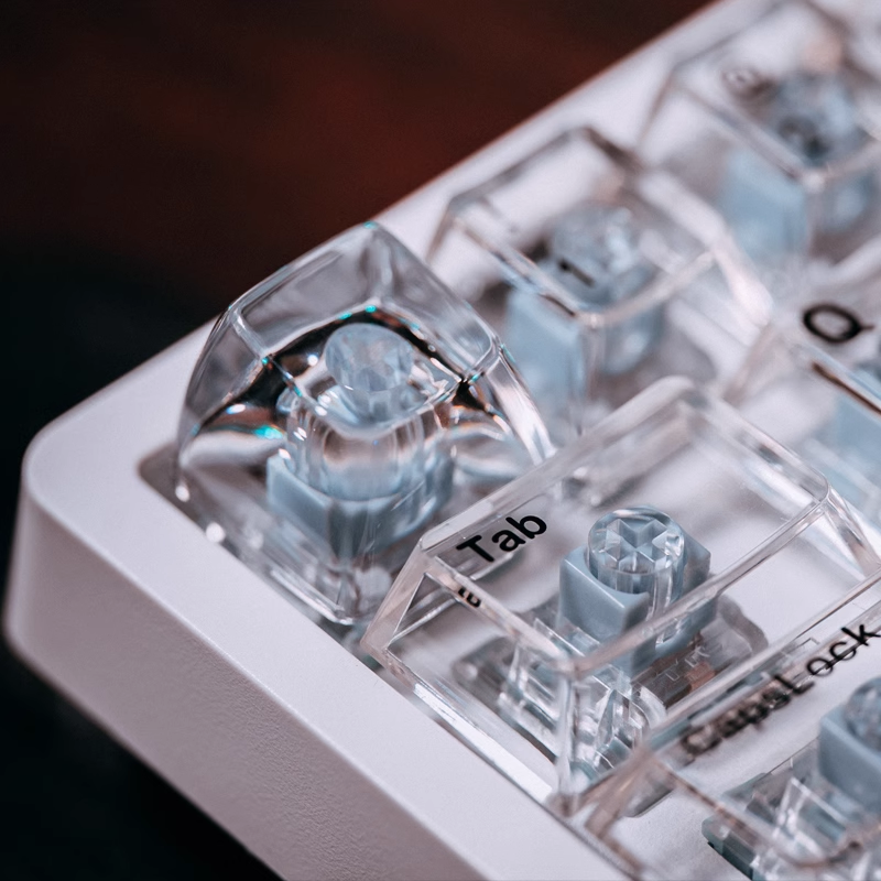 "Dive into a realm of sophistication with our Transparent Keycaps – uniquely crafted with the texture of ice. These Artisan Keycaps are more than mere keys; they are a statement of individuality and craftsmanship. The crystal-clear design adds a touch of elegance to your keyboard, while the ice-textured finish provides a distinctive and cool aesthetic. Elevate your typing experience with the avant-garde appeal of these Transparent Keycaps – a perfect blend of style and functionality.