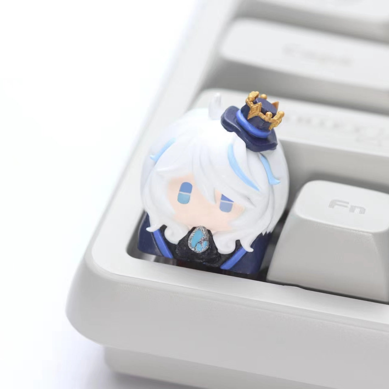 Custom-Genshin-Impact-Furina-Artisan-Keycap Artisan Furina keycap designed for Genshin Impact fans, showcasing a stunning resin finish that adds a unique flair to your typing experience.