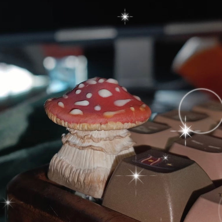 Custom artisan keycap inspired by a red mushroom, handcrafted over 20 days for a lifelike appearance that adds character to your typing experience.