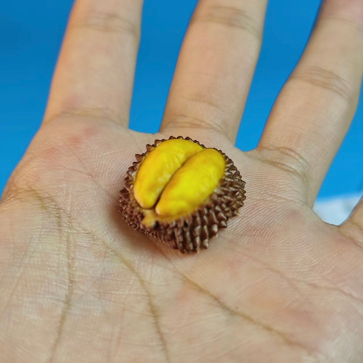 "Introducing our Durian Artisan Keycaps, inspired by the infamous tropical fruit. These keycaps feature the distinctive thorny texture of a durian, meticulously simulated to add a unique touch to your keyboard. While the real fruit has a strong odor, these keycaps bring the durian's visual charm without the scent. Elevate your keyboard with these one-of-a-kind, durian-inspired artisan keycaps." 🌳🍈💻 #KeyboardAccessories #ArtisanKeycaps #DurianDesign
