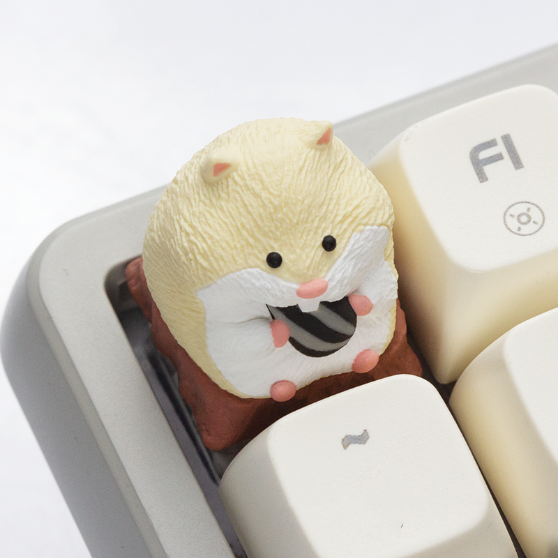 Hamster-shaped artisan keycap featuring a super cute design for mechanical keyboards.