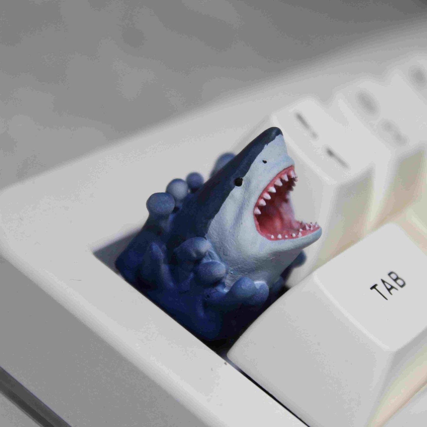Jaws custom artisan keycap featuring a fierce grimacing shark design, compatible with Cherry MX switches.