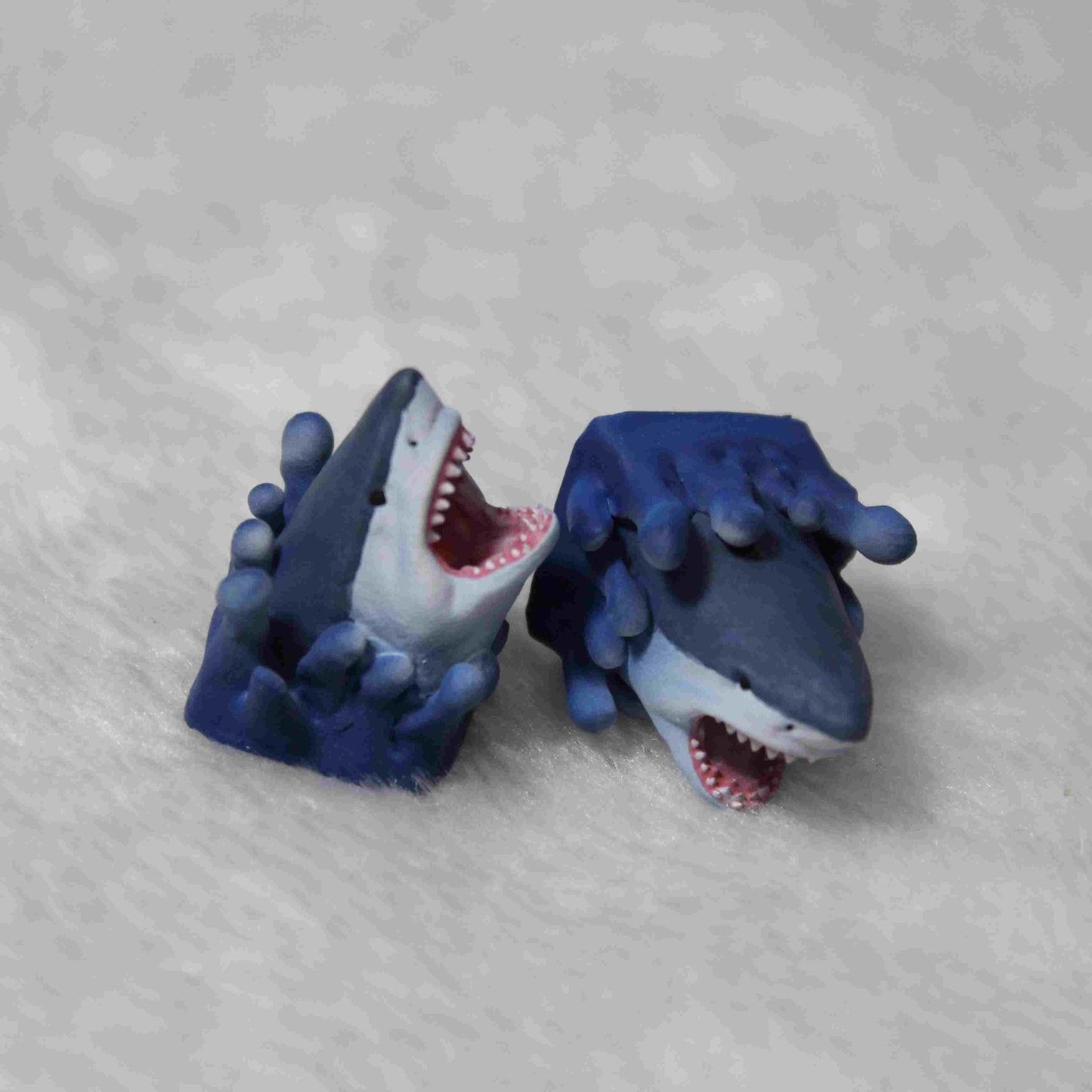 Grimacing shark keycap, Jaws-themed custom artisan keycap for ocean enthusiasts and gamers.