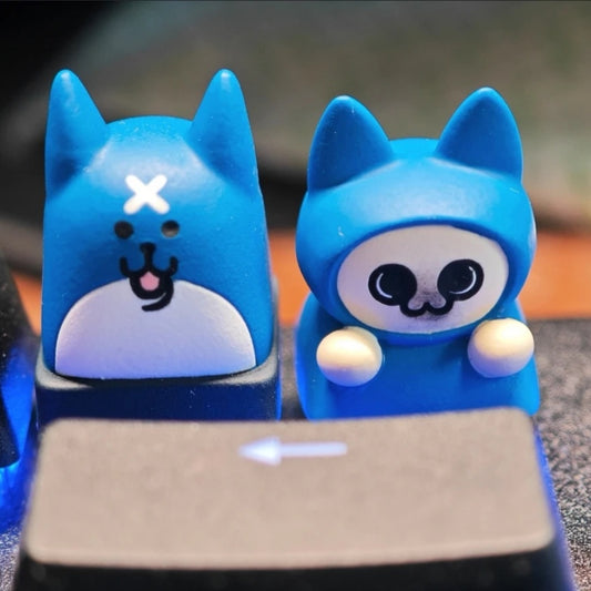 Monster Hunter Palico and Palamute artisan keycaps by aiheystudio, featuring detailed sculpted designs.
