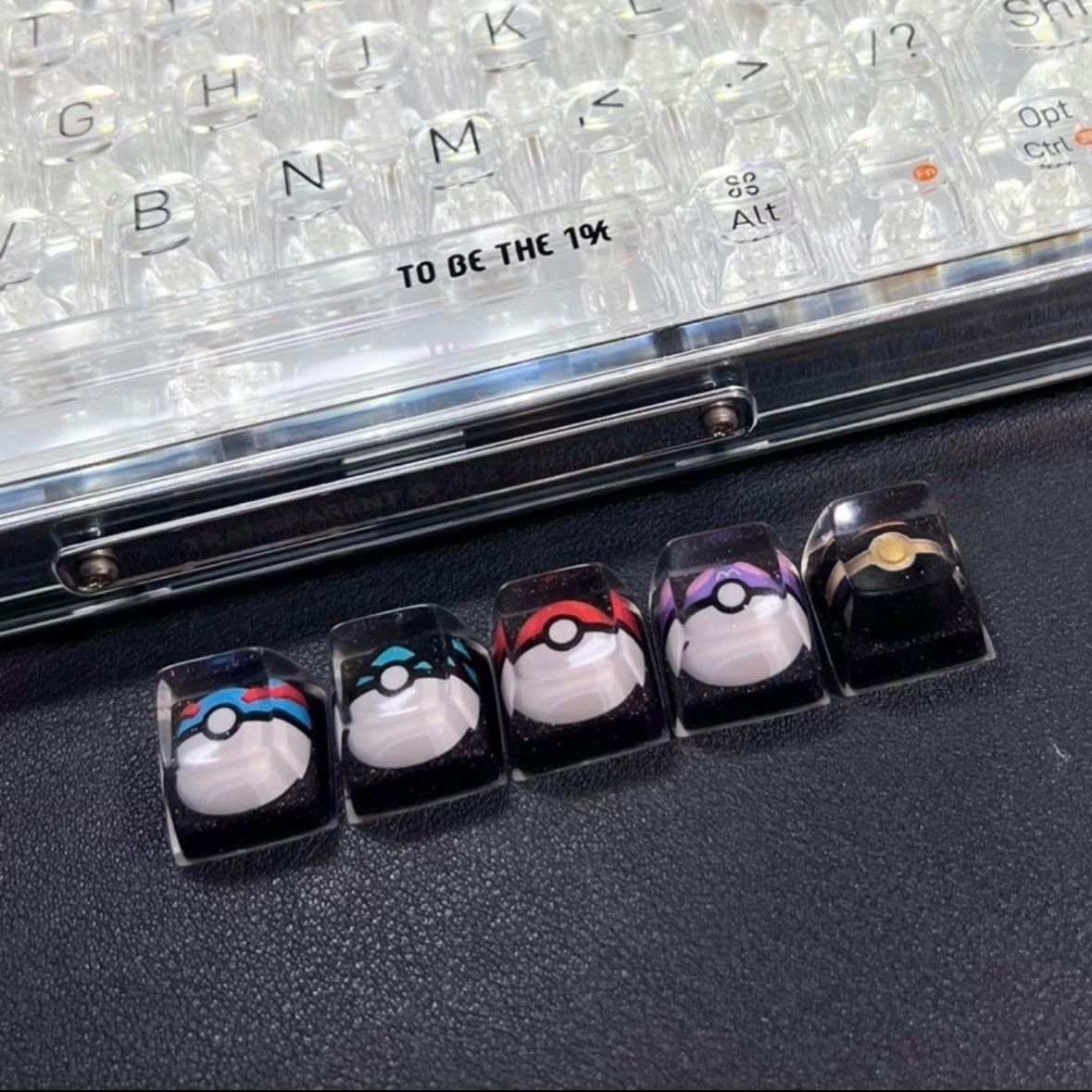 "Capture the essence of Pokémon with our 'Pokémon's Pokeball' Artisan Custom Keycaps. These meticulously crafted keycaps pay homage to the iconic Pokéball design, adding a playful touch to your keyboard. Each keycap is a unique collectible, showcasing your love for the Pokémon universe. Elevate your keyboard setup with these delightful artisan keycaps and embark on a typing adventure." ⚡🔴💻 #KeyboardAccessories #ArtisanKeycaps #PokémonLove