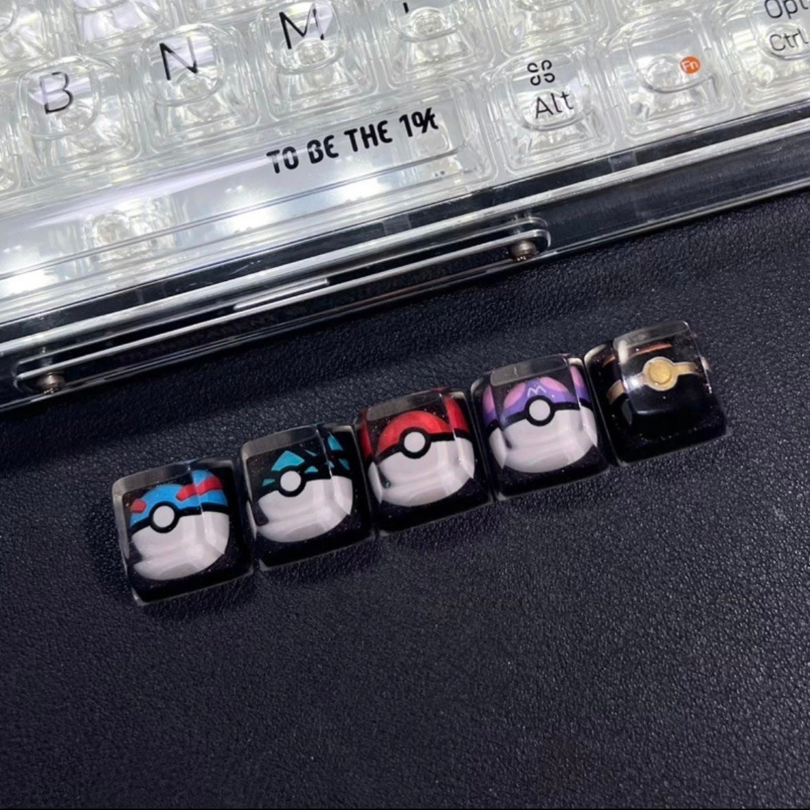 "Capture the essence of Pokémon with our 'Pokémon's Pokeball' Artisan Custom Keycaps. These meticulously crafted keycaps pay homage to the iconic Pokéball design, adding a playful touch to your keyboard. Each keycap is a unique collectible, showcasing your love for the Pokémon universe. Elevate your keyboard setup with these delightful artisan keycaps and embark on a typing adventure." ⚡🔴💻 #KeyboardAccessories #ArtisanKeycaps #PokémonLove