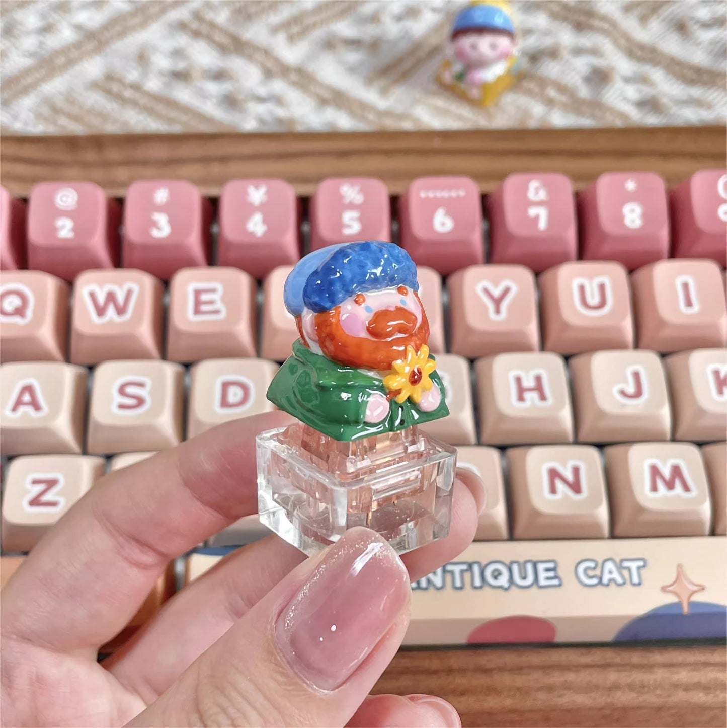 "Indulge in the artistic charm of our Resin Van Gogh Artisan Keycap – a lovable chibi rendition of Van Gogh holding a sunflower. This keycap is not just a functional accessory; it's a true masterpiece. Crafted from high-quality resin and coated with a surface layer, it exudes the delicate elegance of ceramic while being crafted from resin material. Transform your keyboard into a canvas of art with this adorable keycap, where every keystroke becomes a stroke of cuteness and craftsmanship.