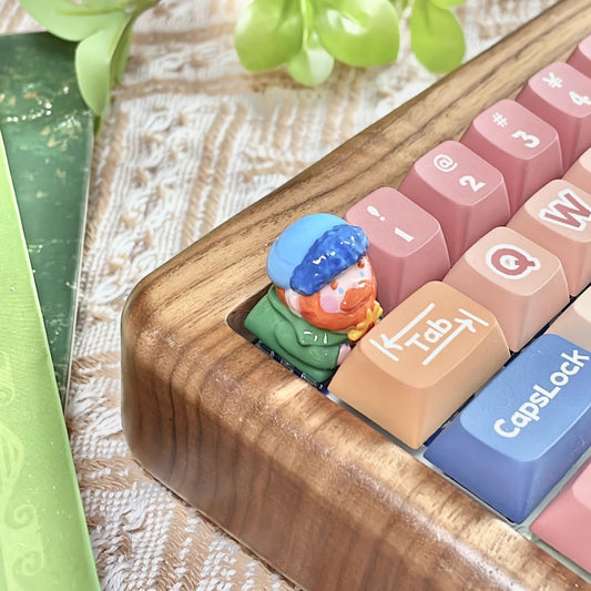 "Indulge in the artistic charm of our Resin Van Gogh Artisan Keycap – a lovable chibi rendition of Van Gogh holding a sunflower. This keycap is not just a functional accessory; it's a true masterpiece. Crafted from high-quality resin and coated with a surface layer, it exudes the delicate elegance of ceramic while being crafted from resin material. Transform your keyboard into a canvas of art with this adorable keycap, where every keystroke becomes a stroke of cuteness and craftsmanship.