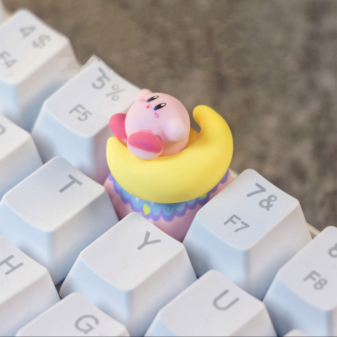 Whimsical artisan keycap of Kirby interacting with the moon, reflecting creativity and fun for gamers and fans alike.