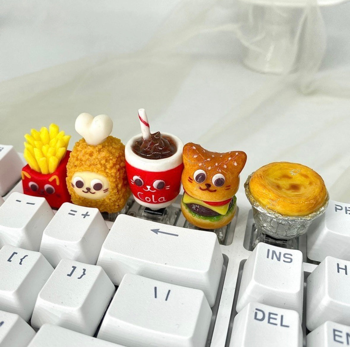 "Indulge in the deliciously whimsical world of our 'Fried Food on the Keyboard' Artisan Keycap. This custom keycap is a playful fusion of keyboard aesthetics and the joy of fried treats. Crafted with precision, it features a delectable assortment of fried foods right on your keyboard. Whether you're a foodie or just want a unique conversation starter, these keycaps add a delightful touch to your setup." 🍟🍔🍗🍕💻 #KeyboardAccessories #ArtisanKeycaps #FoodieFun