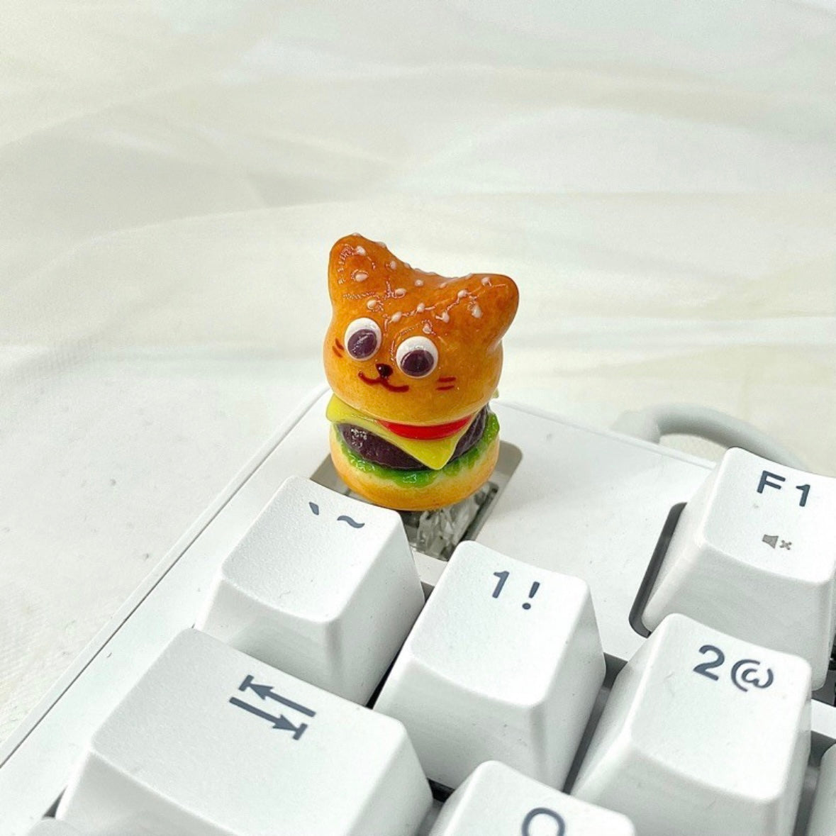 "Indulge in the deliciously whimsical world of our 'Fried Food on the Keyboard' Artisan Keycap. This custom keycap is a playful fusion of keyboard aesthetics and the joy of fried treats. Crafted with precision, it features a delectable assortment of fried foods right on your keyboard. Whether you're a foodie or just want a unique conversation starter, these keycaps add a delightful touch to your setup." 🍟🍔🍗🍕💻 #KeyboardAccessories #ArtisanKeycaps #FoodieFun