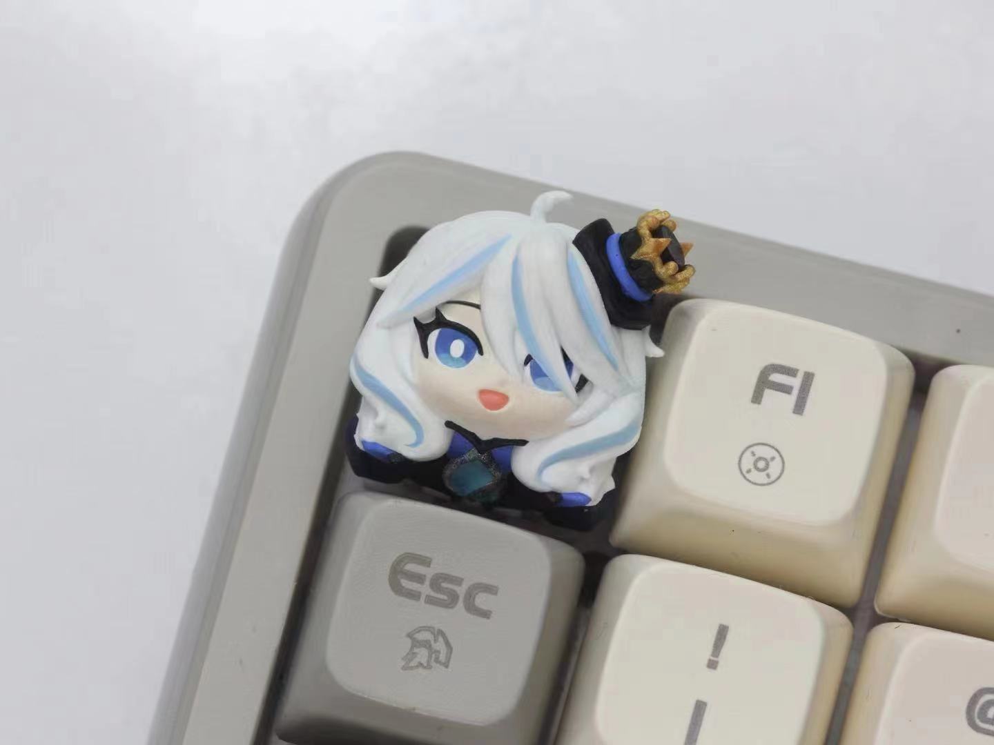 Furina Artisan keycap Custom Genshin impact keycaps Stunning Furina Artisan Keycap, designed to celebrate the enchanting qualities of this Genshin Impact character while enhancing your typing experience.