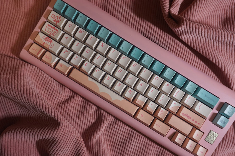 Sunset Highway keycaps blend the soft pink hues of the evening sky with shades of light green, creating a tranquil and cozy atmosphere. However, in our choice of elements, we intentionally infuse a touch of vintage from a bygone era.