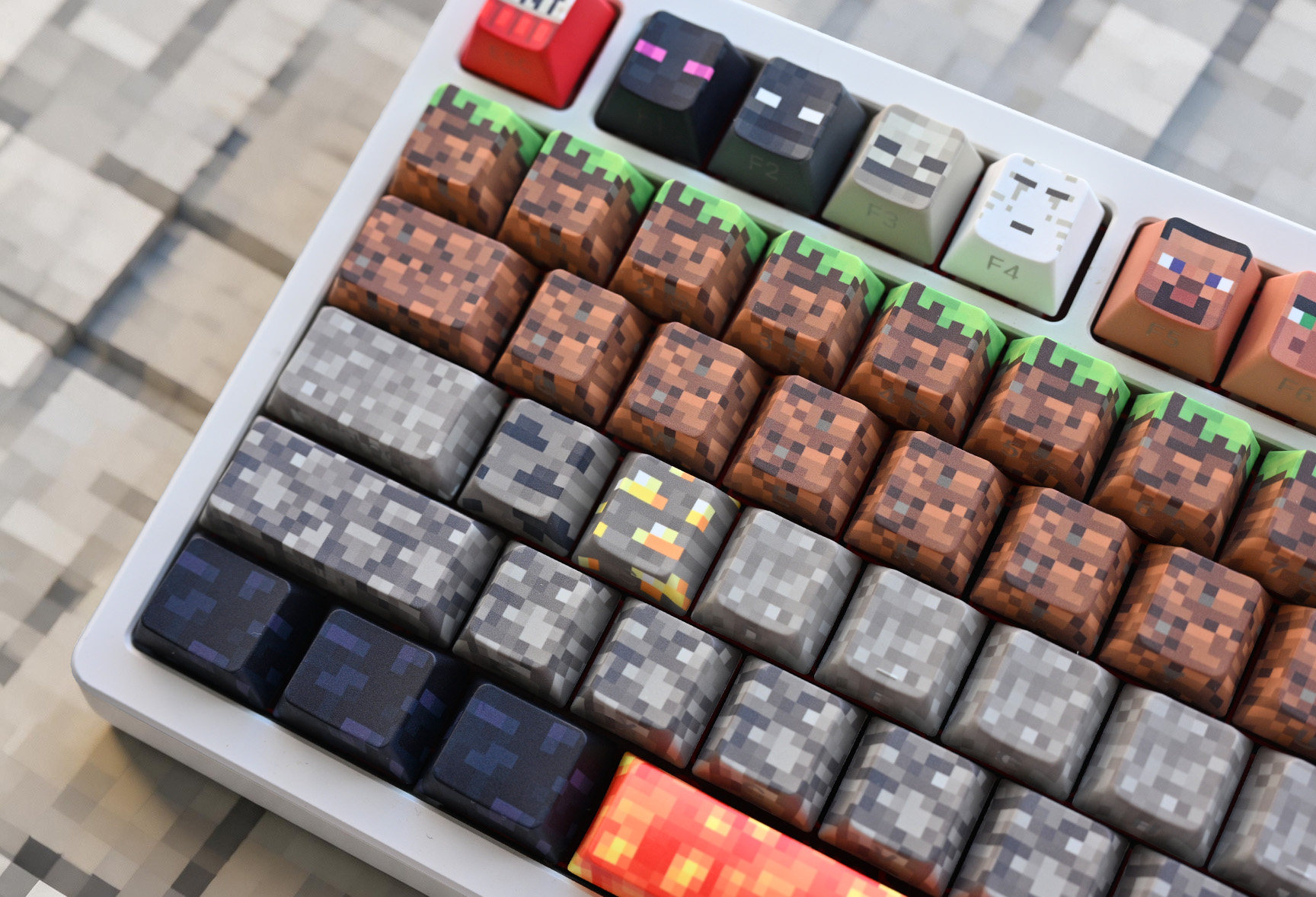Detailed view of Minecraft dirt, stone, ore and lava mechanical keyboard keycaps