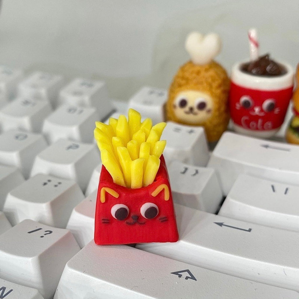 "Indulge in the deliciously whimsical world of our 'Fried Food on the Keyboard' Artisan Keycap. This custom keycap is a playful fusion of keyboard aesthetics and the joy of fried treats. Crafted with precision, it features a delectable assortment of fried foods right on your keyboard. Whether you're a foodie or just want a unique conversation starter, these keycaps add a delightful touch to your setup." 🍟🍔🍗🍕💻 #KeyboardAccessories #ArtisanKeycaps #FoodieFun
