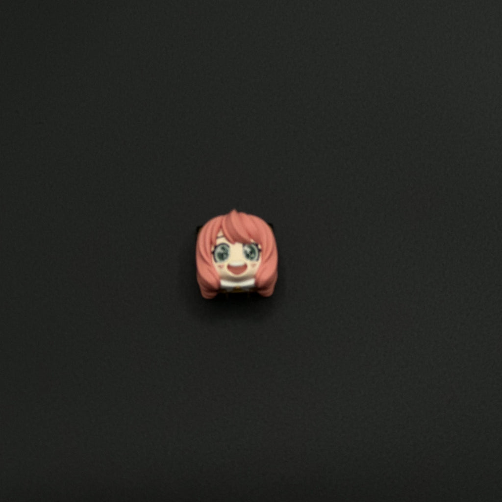 3D Anya Forger keycap in pink, a cute and unique artisan design from SPY x FAMILY to brighten up your mechanical keyboard