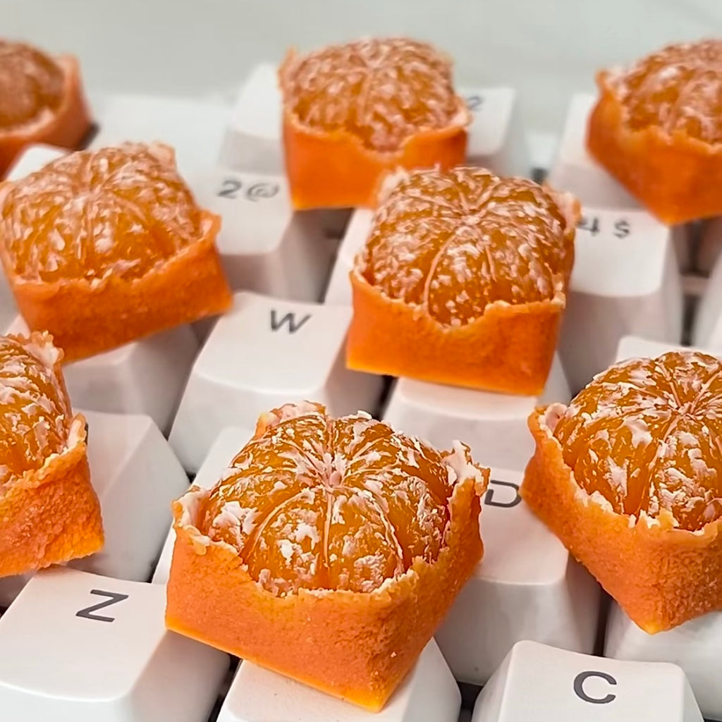 A square Orange or Tangerine Artisan keycap Custom keycaps The simulated orange keycaps are like a real little orange on your keycaps, it's like I can smell the orange through the computer screen.