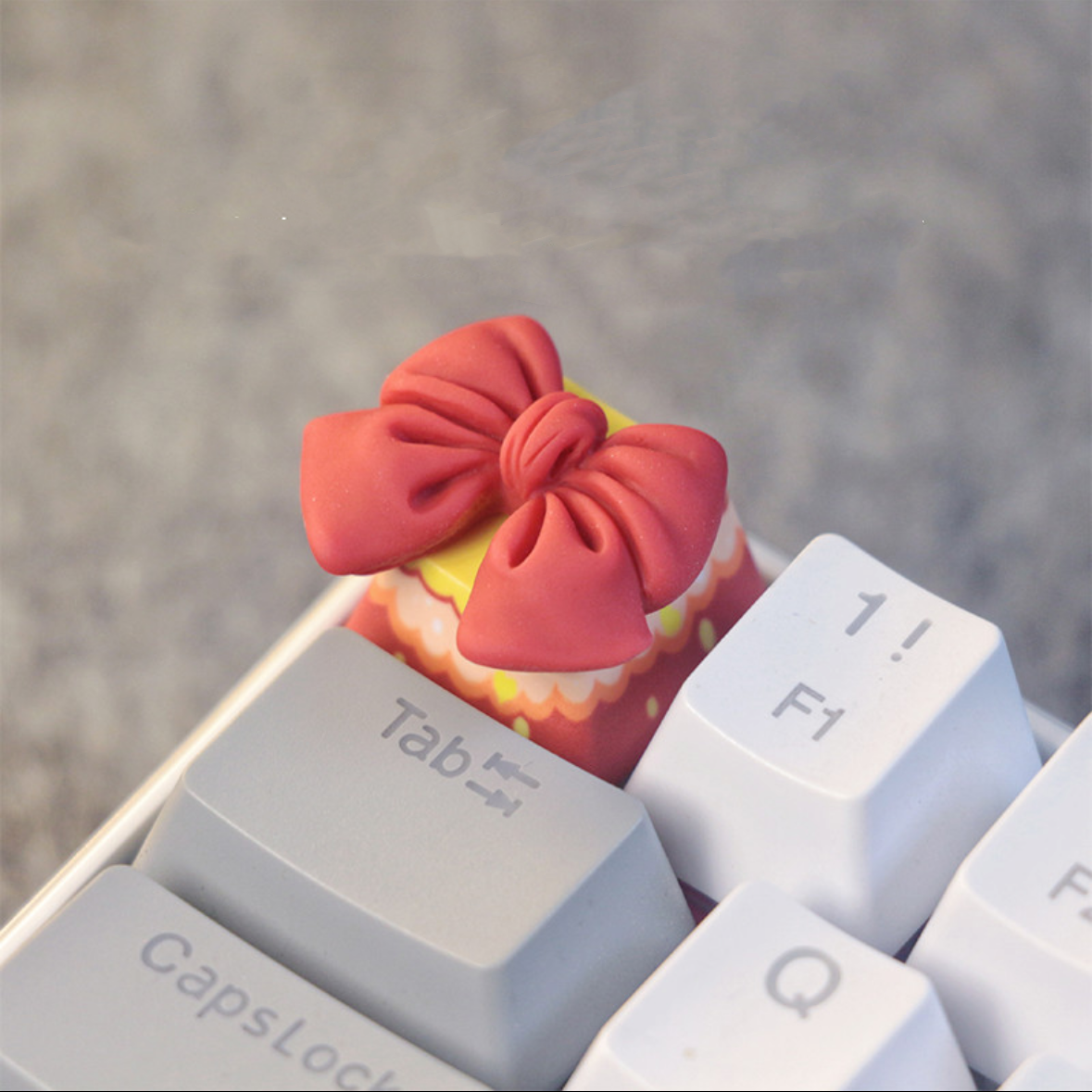 "Elevate your keyboard's style with our unique Bow Tie Custom Artisan Keycaps. Handcrafted with attention to detail, these keycaps are designed to add a touch of elegance to your setup. Each keycap features a bow tie design, making a fashion statement while you type. Stand out from the crowd with these one-of-a-kind artisan keycaps." 🎩💻 #KeyboardAccessories #ArtisanKeycaps #BowTieDesign