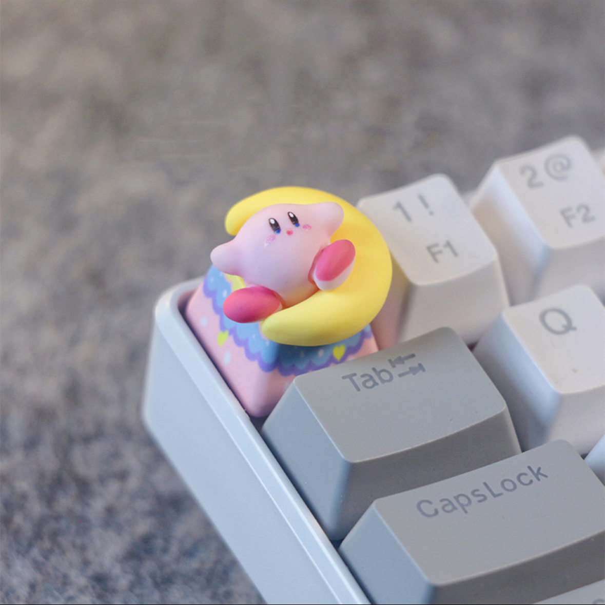 Kirby and Moon Custom Keycaps Artisan keycap"Embark on a whimsical journey with our 'Kirby and Moon' Custom Artisan Keycaps. These handcrafted keycaps feature the lovable Kirby alongside a serene moon, creating a dreamy and enchanting keyboard experience. Crafted with meticulous attention to detail, these keycaps add a touch of charm and magic to your setup. Join Kirby on an adventure among the stars with these captivating artisan keycaps."  #KeyboardAccessories #ArtisanKeycaps #KirbyAdventure