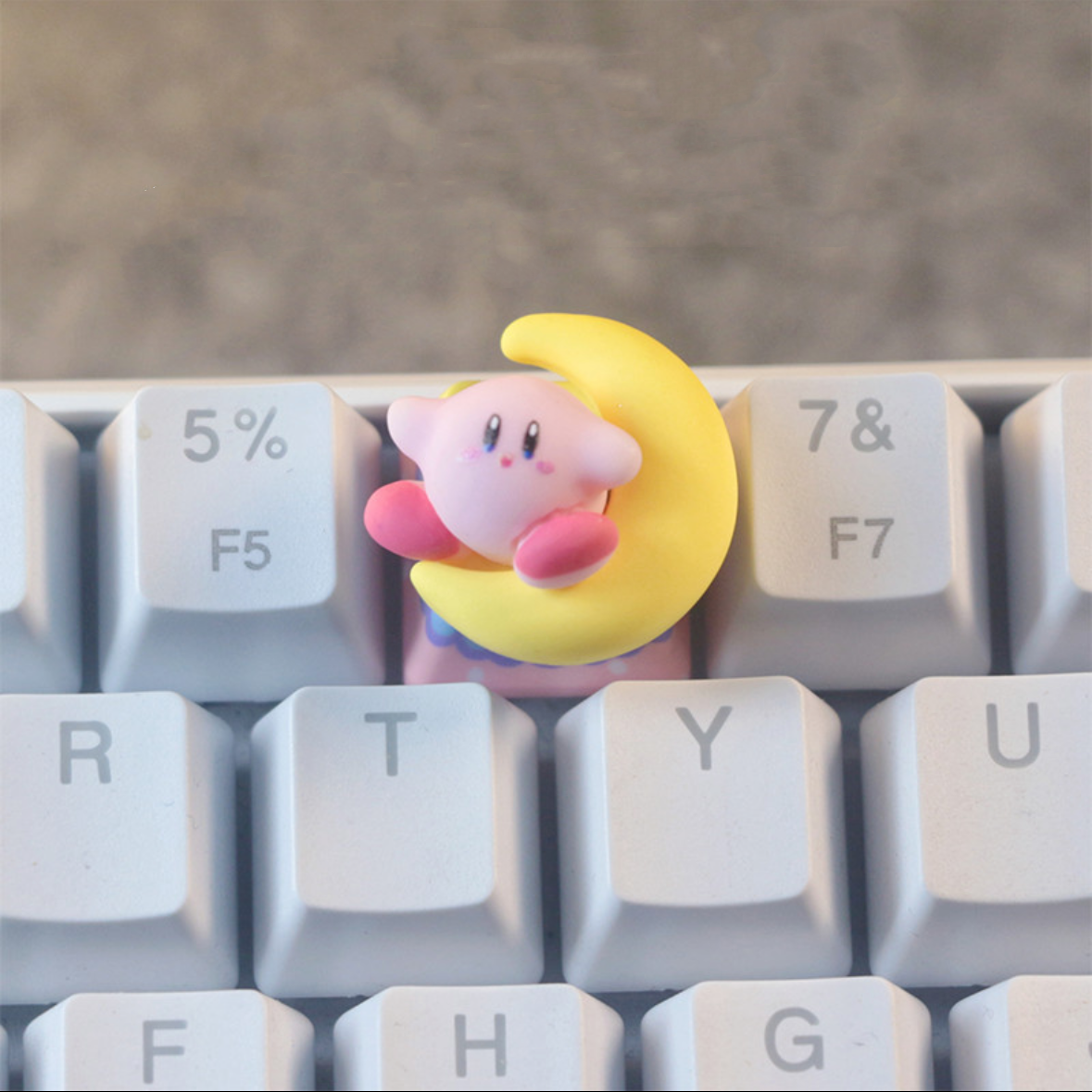 "Embark on a whimsical journey with our 'Kirby and Moon' Custom Artisan Keycaps. These handcrafted keycaps feature the lovable Kirby alongside a serene moon, creating a dreamy and enchanting keyboard experience. Crafted with meticulous attention to detail, these keycaps add a touch of charm and magic to your setup. Join Kirby on an adventure among the stars with these captivating artisan keycaps."  #KeyboardAccessories #ArtisanKeycaps #KirbyAdventure