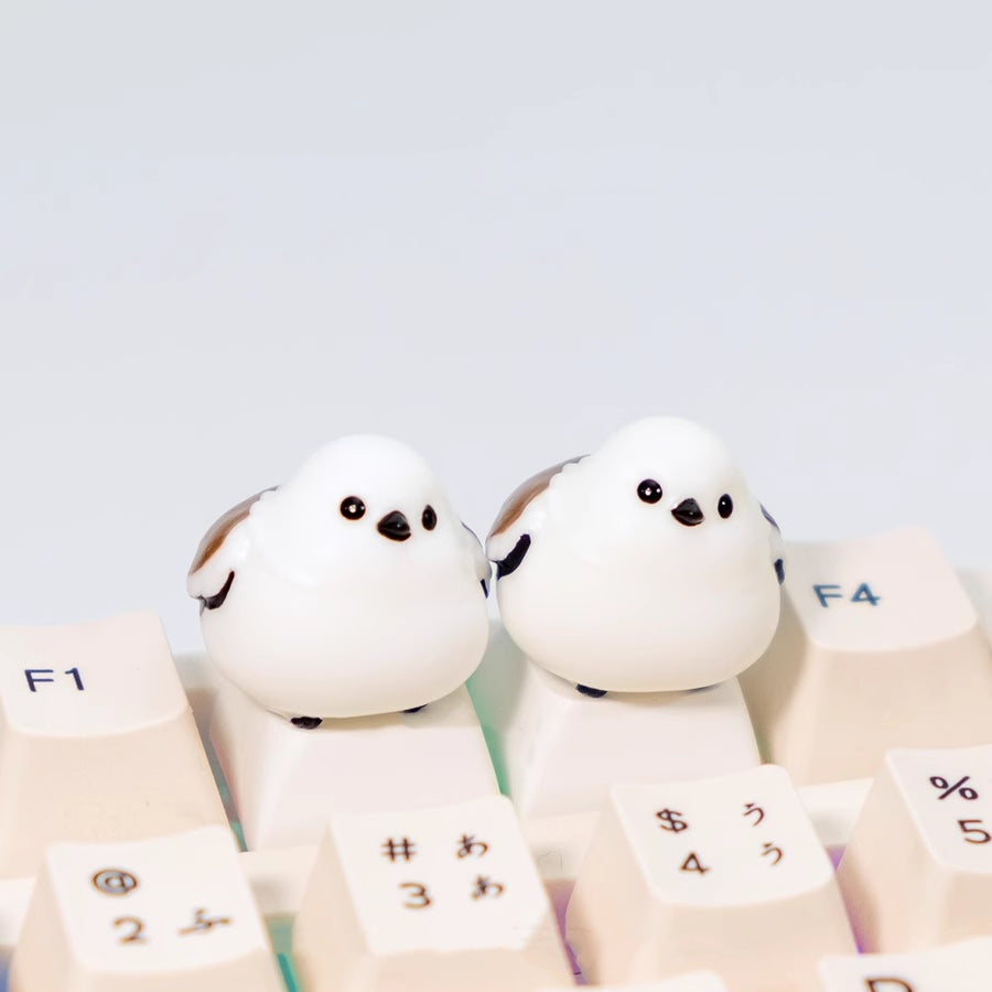 Embrace the charm of chubby mountain sparrows with our adorable white keycap. Add a touch of nature's delight to your keyboard. Tweet your way to a unique typing experience!