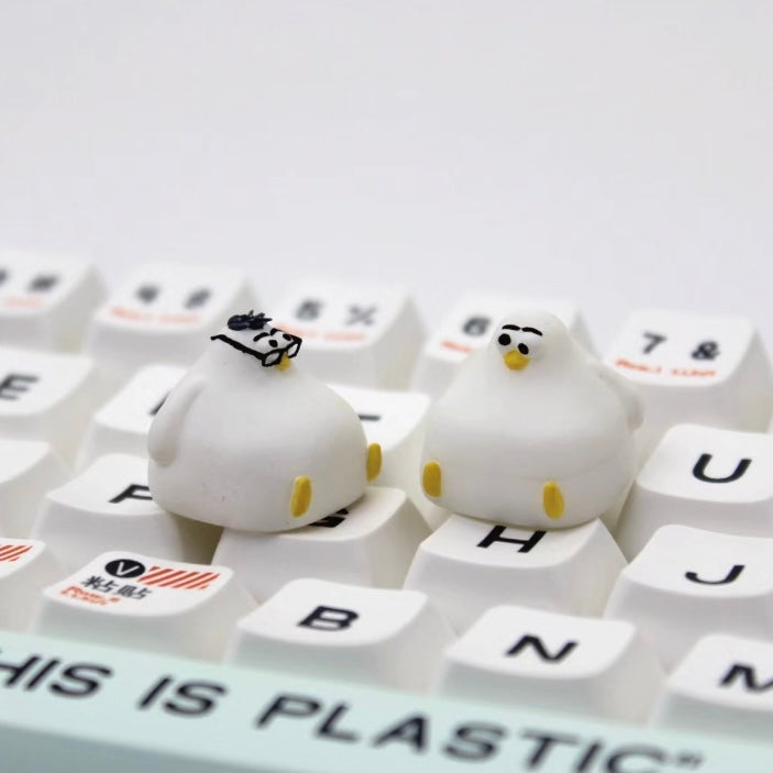 Chubby seagull custom artisan keycap with glasses, a cute and bulky design for adding personality to your mechanical keyboard.
