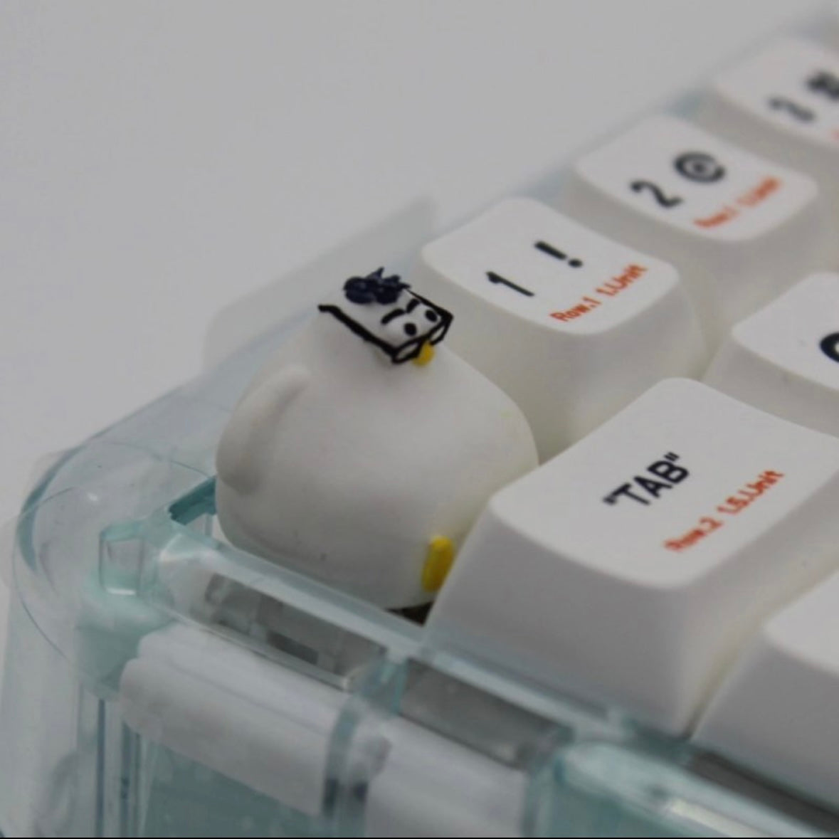 Cute chubby seagull artisan keycap with glasses, perfect for those looking to add a fun, quirky touch to their keyboard setup.