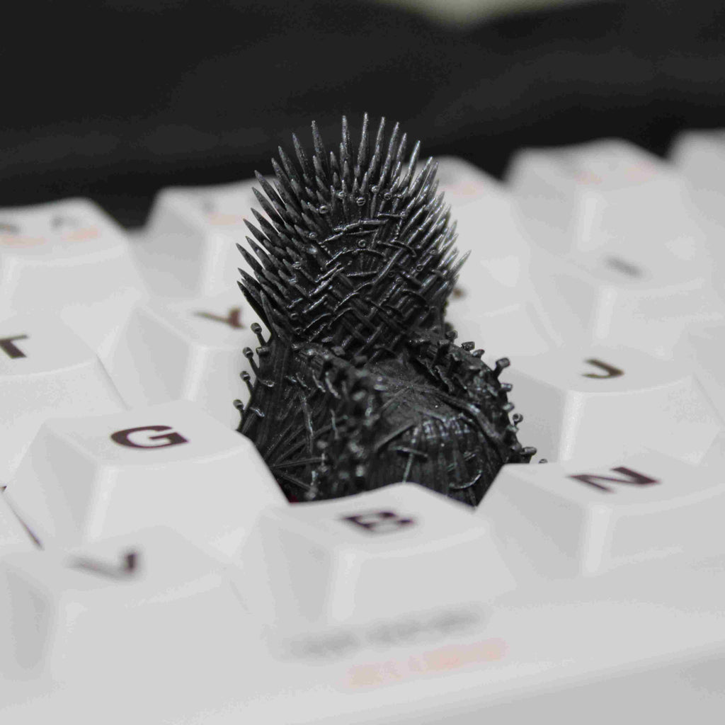 Iron Throne artisan keycap inspired by Game of Thrones, custom keycap for mechanical keyboards, ideal for fans of the series.
