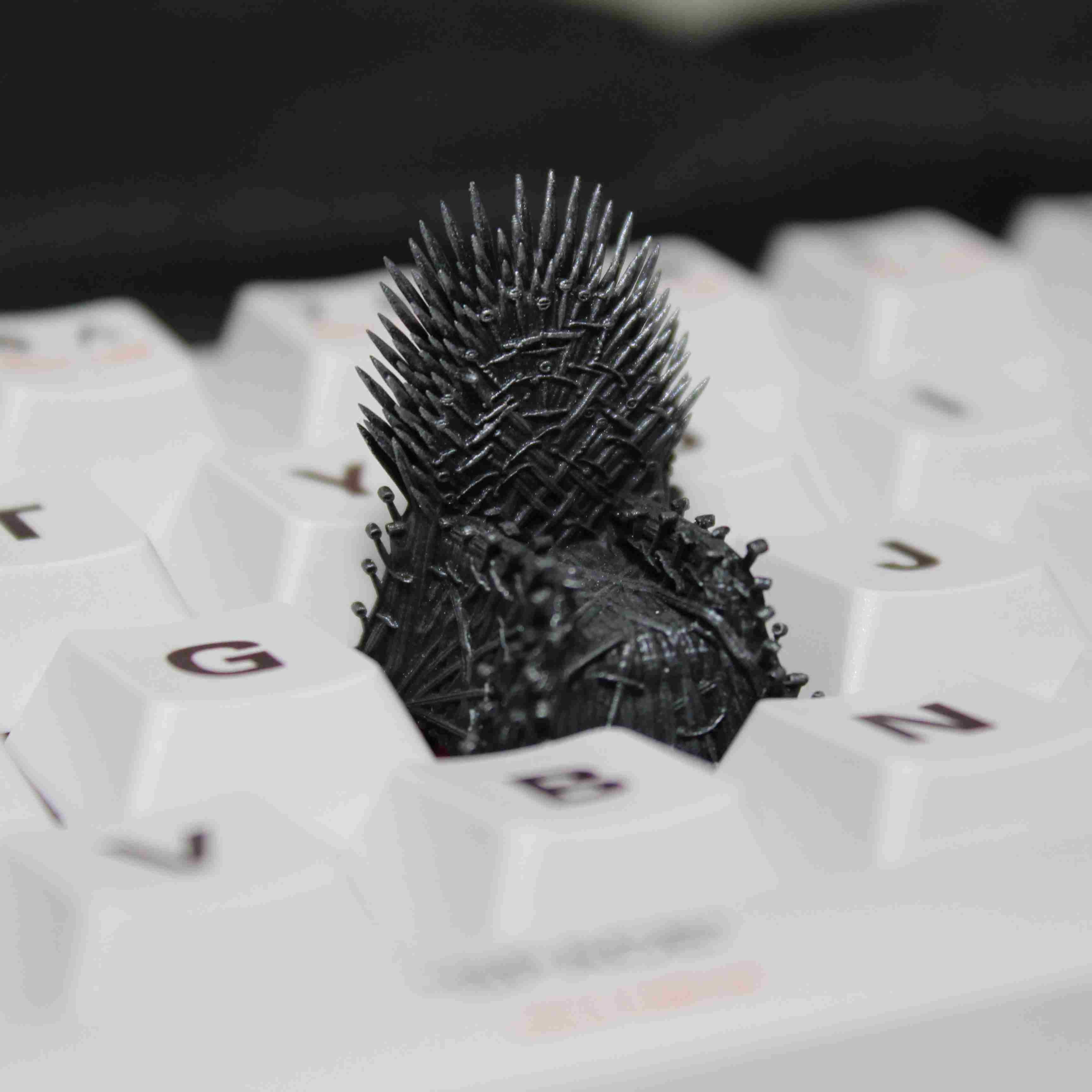 Iron Throne artisan keycap inspired by Game of Thrones, custom keycap for mechanical keyboards, ideal for fans of the series.
