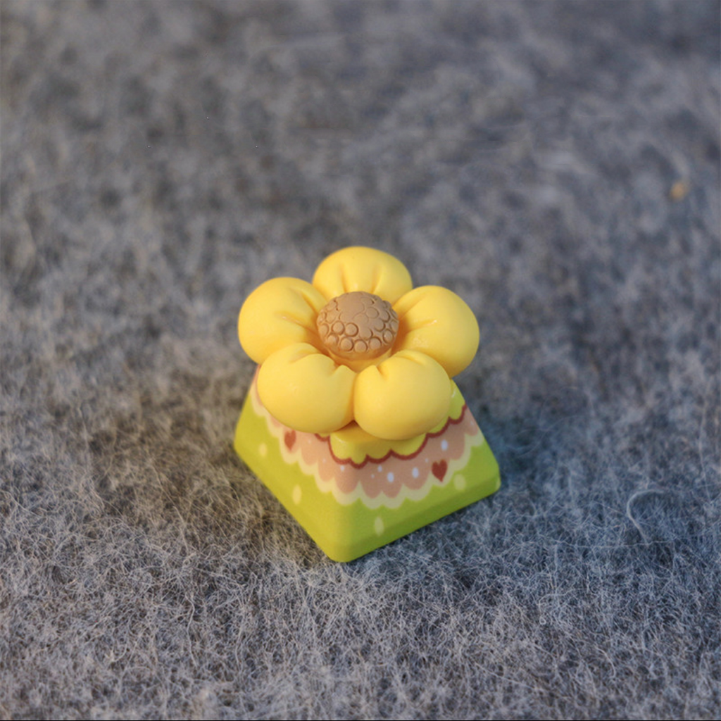 A Little Yellow Flower Artisan Custom keycap Handcrafted yellow flower keycap, perfect for nature lovers looking to bring a touch of spring to their mechanical keyboard.
