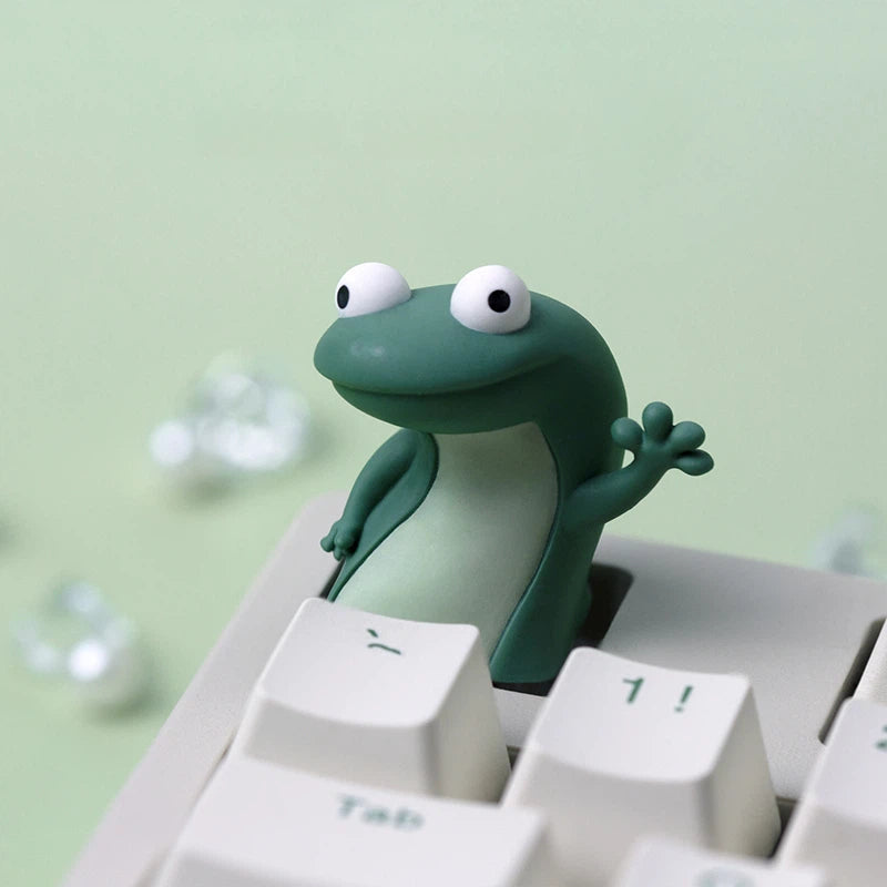 Handmade epoxy resin frog keycap designed for cute mechanical keyboard collections. Featuring colorful frog characters with smooth three-dimensional details, this artisan keycap brings a cozy and fun atmosphere to any workspace.