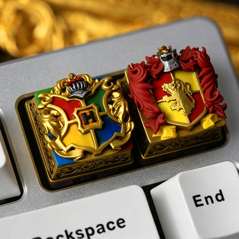 Three-dimensional Hogwarts crest resin keycap handcrafted with layered epoxy resin techniques. The detailed emblem textures and magical design make it a unique ESC key or artisan accent key for mechanical keyboards.