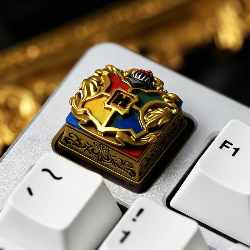 Detailed Hogwarts House Crest resin artisan keycap collection featuring Gryffindor, Slytherin, Ravenclaw, Hufflepuff, and Hogwarts symbols. Handmade with layered epoxy resin and polished finish, designed for mechanical keyboard enthusiasts and Harry Potter fans.