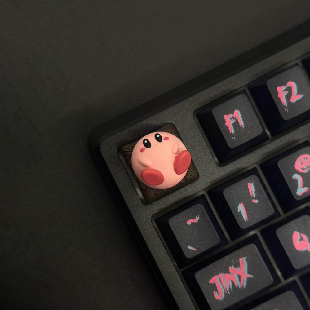 This custom artisan keycap features Kirby in all his adorable glory, meticulously crafted to add a touch of charm and nostalgia to your setup.