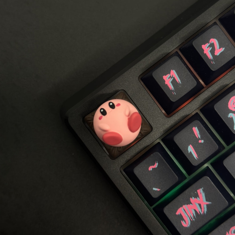 This custom artisan keycap features Kirby in all his adorable glory, meticulously crafted to add a touch of charm and nostalgia to your setup.