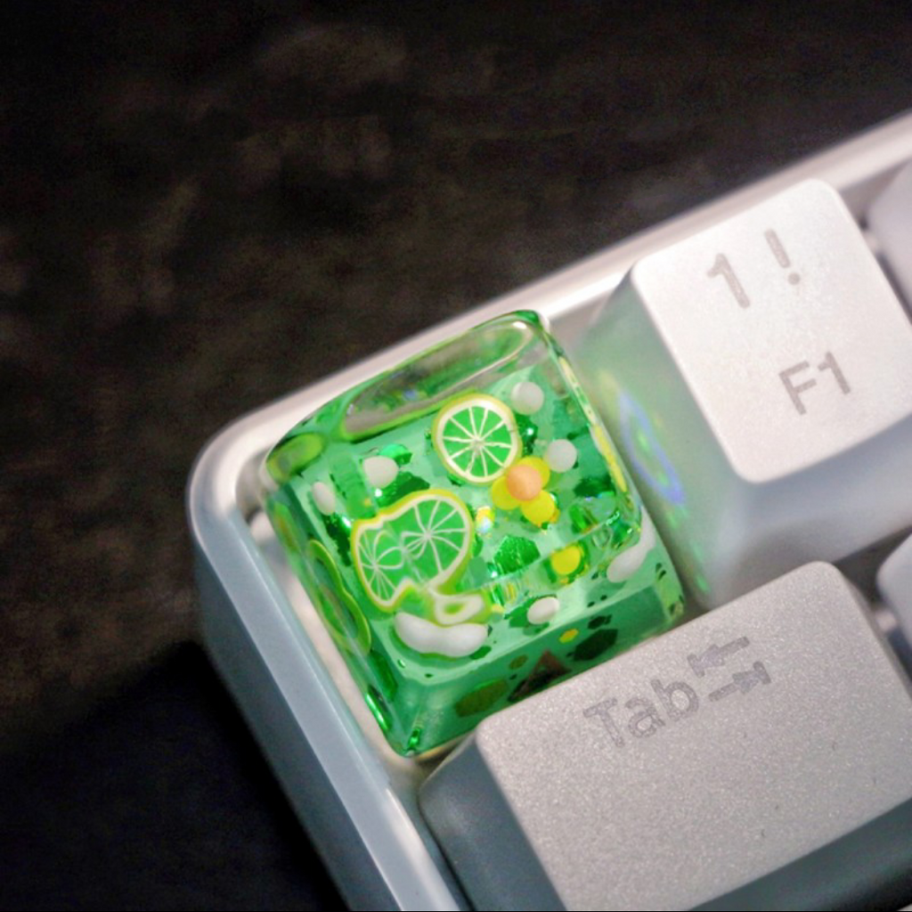"Refresh your keyboard setup with our 'Lime Soda' Custom Artisan Keycaps. These handcrafted keycaps are inspired by the zesty goodness of lime soda, bringing a burst of citrusy charm to your typing experience. Crafted with precision, they feature a playful lime soda design that's both stylish and unique. Quench your thirst for creativity with these delightful artisan keycaps." 🍋🥤💻 #KeyboardAccessories #ArtisanKeycaps #LimeSodaVibes