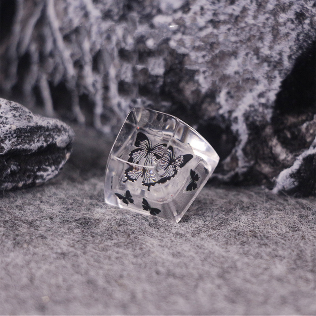 "Unveil the allure of our 'Mysterious Black and White Butterfly' Custom Artisan Keycaps. Crafted with precision, these handcrafted keycaps showcase the elegance of a black and white butterfly, adding a touch of mystique to your keyboard. Their unique design sets them apart, making each keystroke a work of art. Elevate your keyboard aesthetics with these captivating artisan keycaps." 🦋🖤💻 #KeyboardAccessories #ArtisanKeycaps #ButterflyDesign