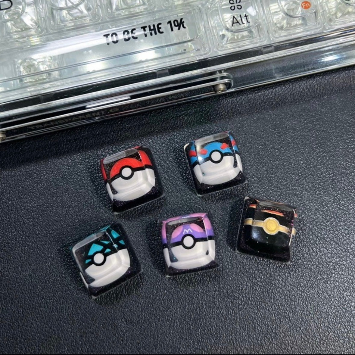 "Capture the essence of Pokémon with our 'Pokémon's Pokeball' Artisan Custom Keycaps. These meticulously crafted keycaps pay homage to the iconic Pokéball design, adding a playful touch to your keyboard. Each keycap is a unique collectible, showcasing your love for the Pokémon universe. Elevate your keyboard setup with these delightful artisan keycaps and embark on a typing adventure." ⚡🔴💻 #KeyboardAccessories #ArtisanKeycaps #PokémonLove