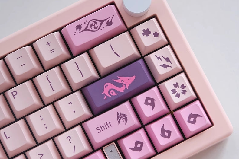 Elevate your keyboard to new heights with the commanding presence of Raiden Shogun and the enchanting allure of Yaemiko. Immerse yourself in the world of Genshin Impact with this exclusive keycap set that brings the electro-powered duo to life on your fingertips. Unleash the thunder and illuminate your gaming or typing experience with the Raiden Shogun and Yaemiko Keycaps Set – a must-have for fans and enthusiasts alike!