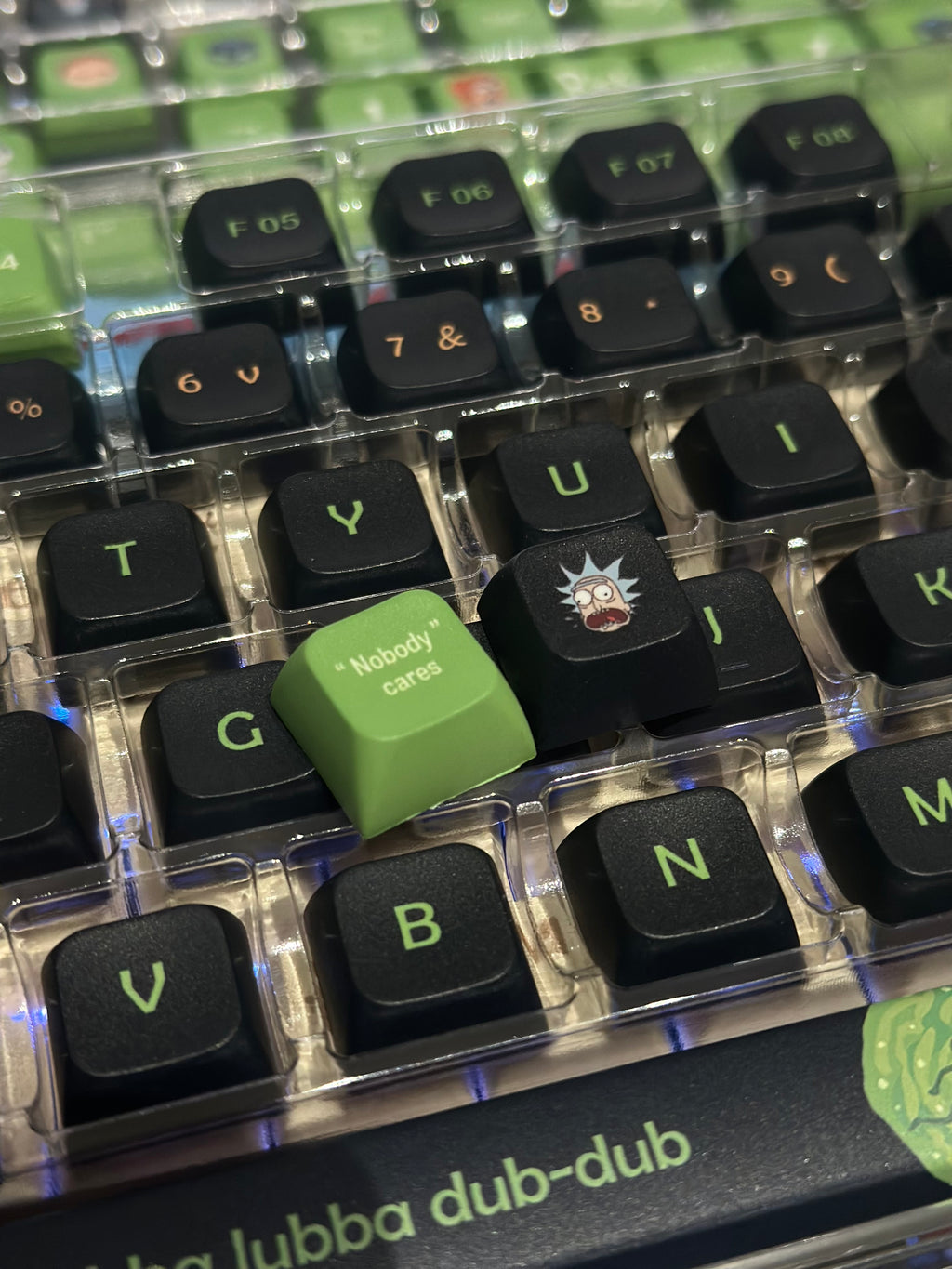 Green and black Rick and Morty artisan keycap set from aiheystudio, perfect for fans and gamers.