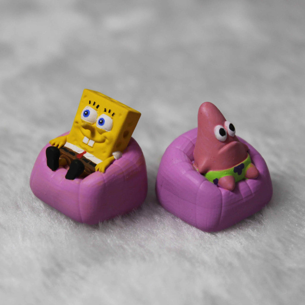 "Dive into the whimsical world of Bikini Bottom with our SpongeBob and Patrick Custom Artisan Keycaps. These 3D-printed keycaps are not just accessories; they're a playful homage to the iconic duo. Imagine SpongeBob asking, 'Hey Patrick, do you know what's funnier than 24?' and Patrick responding, 'Umm, 25?' Each keystroke becomes a snippet of their hilarious banter. Crafted with precision and humor, these keycaps bring the charm of SpongeBob and Patrick to your fingertips. 