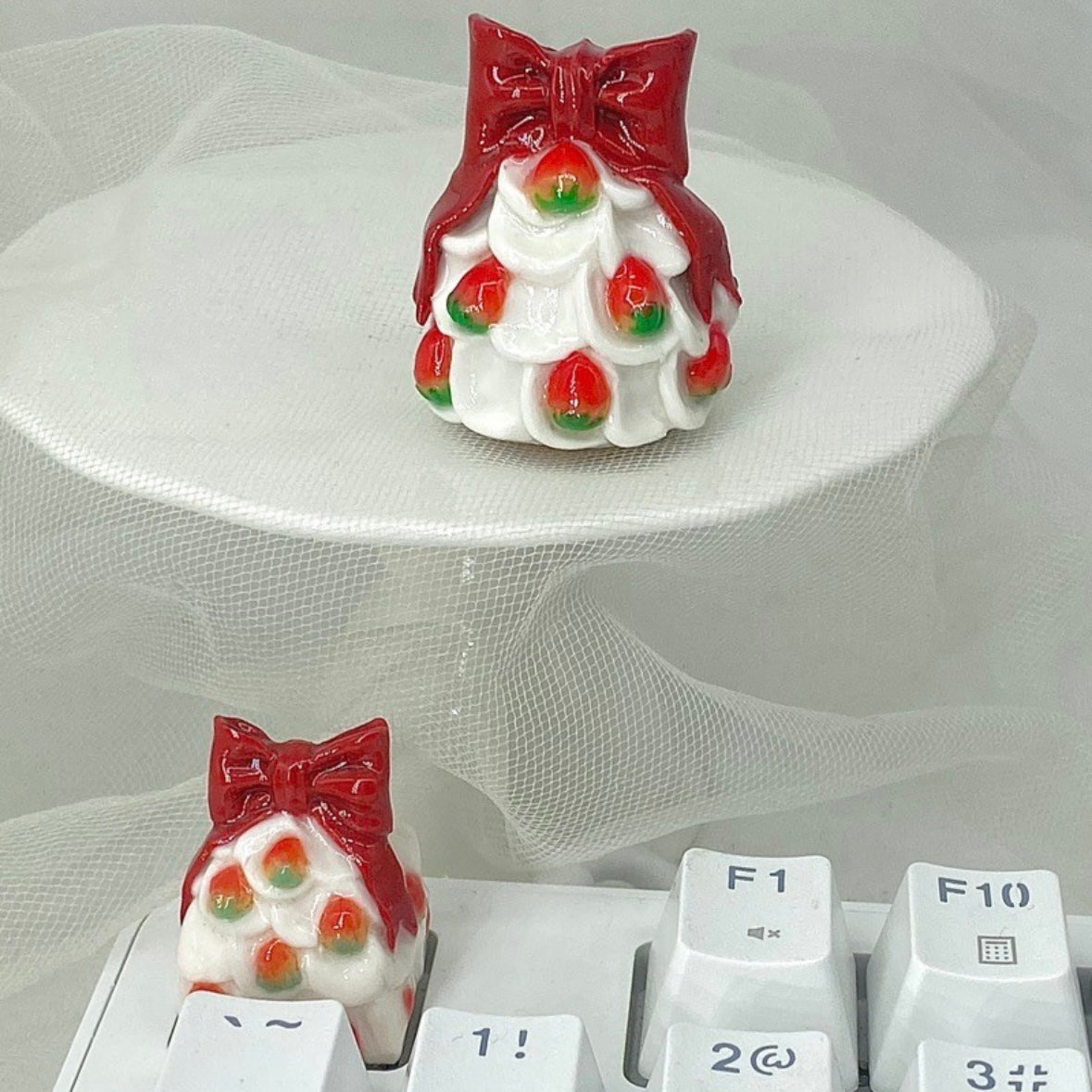 "Get into the holiday spirit with our 'Strawberry Christmas Tree Gift' Custom Artisan Keycaps. Handcrafted with care, these keycaps feature a whimsical design of a strawberry Christmas tree gift, adding a touch of festive cheer to your keyboard. They make for a delightful gift for yourself or fellow enthusiasts. Elevate your keyboard setup with these unique and charming artisan keycaps." 🍓🎄🎁 #Keycaps #ArtisanKeycaps #ChristmasCheer