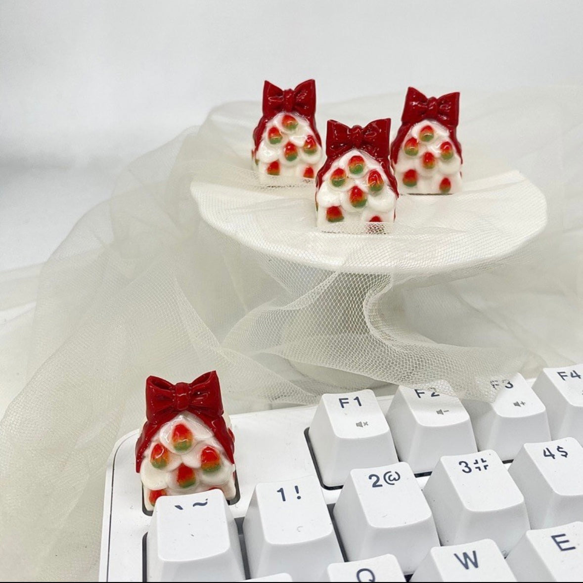 "Get into the holiday spirit with our 'Strawberry Christmas Tree Gift' Custom Artisan Keycaps. Handcrafted with care, these keycaps feature a whimsical design of a strawberry Christmas tree gift, adding a touch of festive cheer to your keyboard. They make for a delightful gift for yourself or fellow enthusiasts. Elevate your keyboard setup with these unique and charming artisan keycaps." 🍓🎄🎁 #Keycaps #ArtisanKeycaps #ChristmasCheer