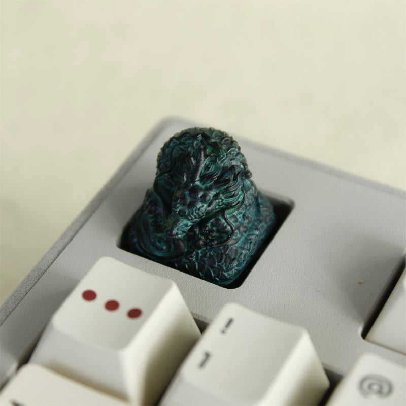 Aged bronze Oriental Dragon artisan keycap with antique metal finish and detailed mythical creature texture