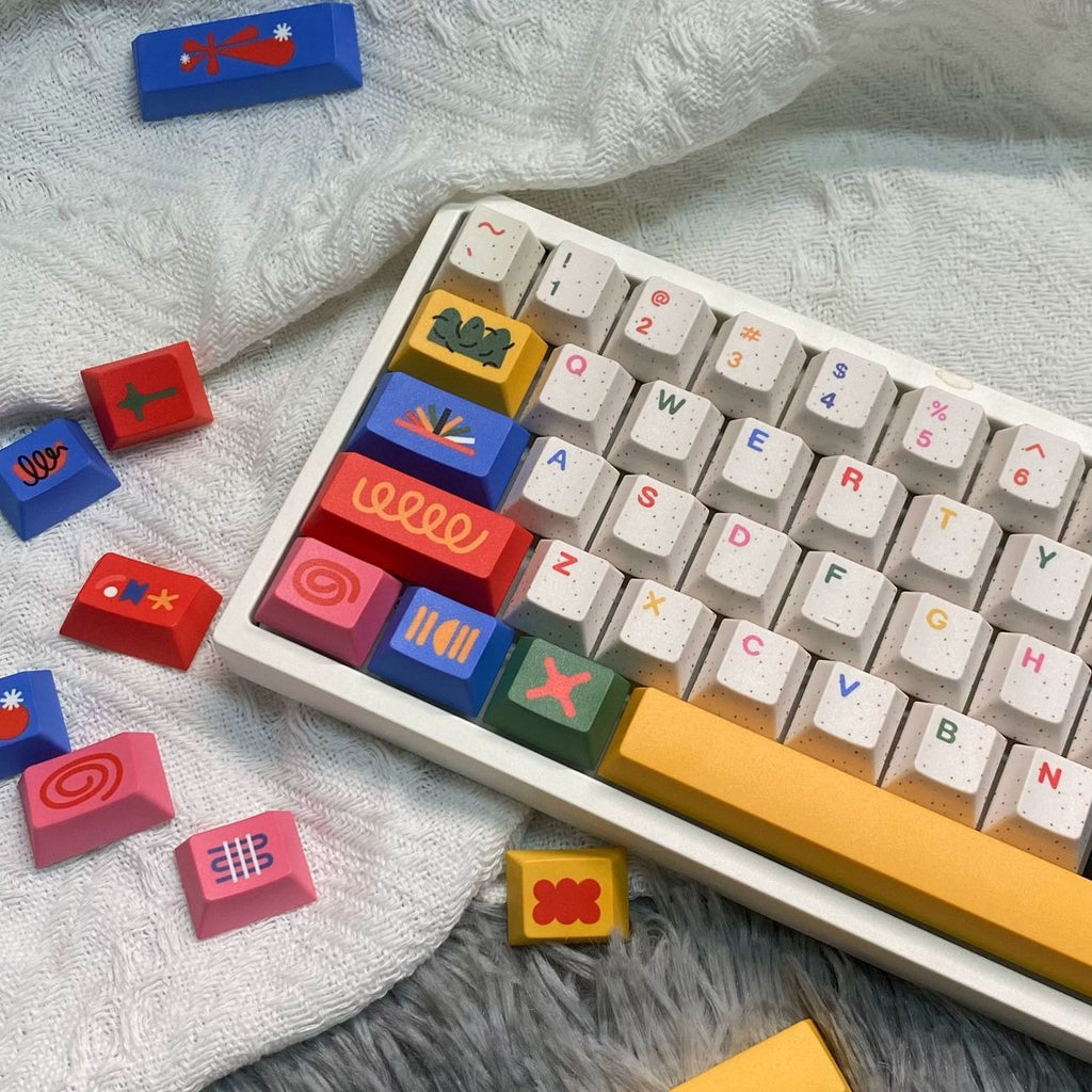 Custom mechanical keyboard featuring colorful motif PBT keycaps with modern artistic design for gaming and workspace setups